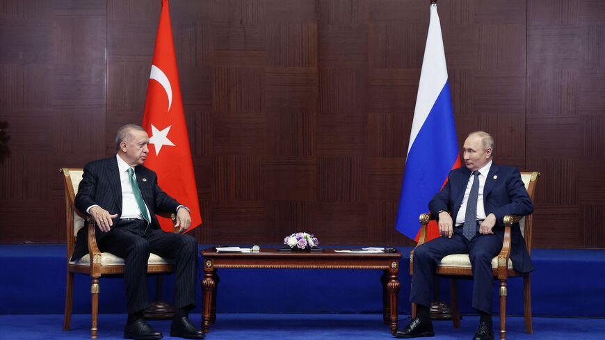 TOPSHOT - Russian President Vladimir Putin meets with Turkey's President Recep Tayyip Erdogan on the sidelines of the Sixth Summit of the Conference on Interaction and Confidence Building Measures in Asia (CICA) in Astana on October 13, 2022.