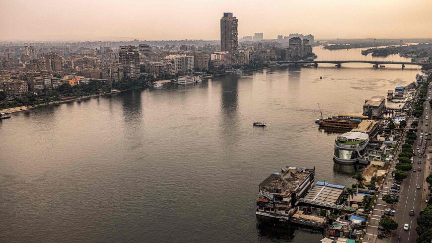 This picture taken on November 1, 2022 shows a view of the Nile river between Egypt's capital Cairo (L) and its twin city of Giza (R). - The Pharaohs worshipped it as a god, the eternal bringer of life, but the clock is ticking on the Nile. Climate change, pollution and exploitation by man is putting existential unsustainable pressure on the world's second longest river on which millions of Africans depend. (Photo by Khaled DESOUKI / AFP) (Photo by KHALED DESOUKI/AFP via Getty Images)