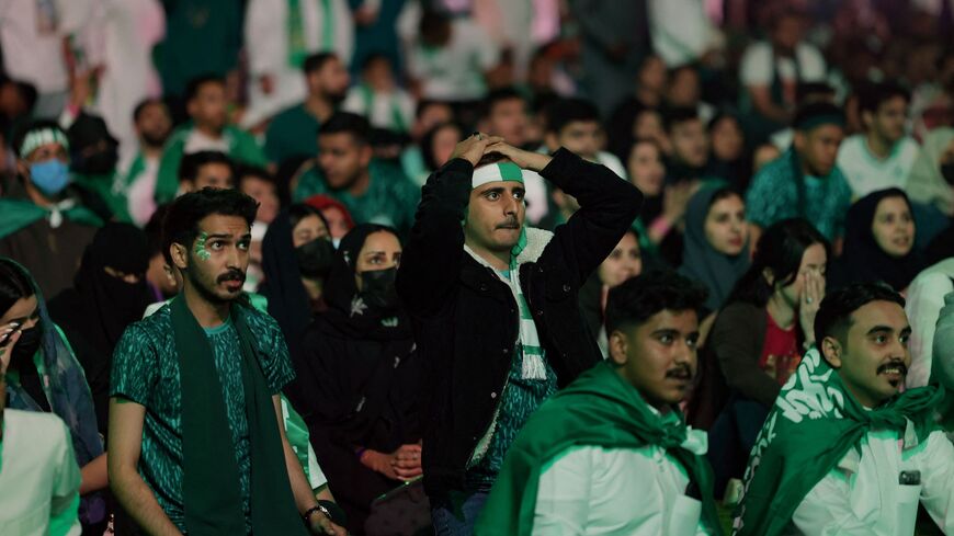 Saudi fans react as they watch on a screen the Qatar 2022 World Cup Group C football match between their national team and Mexico, at the Marsool Park in Riyadh, on November 30, 2022. (Photo by Fayez Nureldine / AFP) (Photo by FAYEZ NURELDINE/AFP via Getty Images)