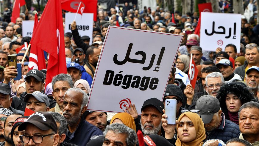 Tunisian demonstrators take part in a rally against President Kais Saied, called for by the opposition "National Salvation Front" coalition, in the capital Tunis, on December 10, 2022. (Photo by FETHI BELAID/AFP via Getty Images)