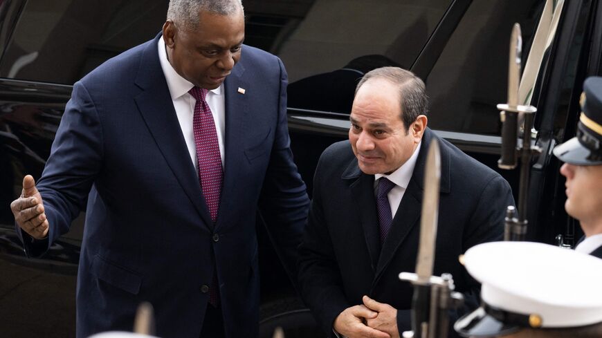 US Secretary of Defense Lloyd Austin greets Egyptian President Abdel Fattah El-Sisi (R) as he arrives for meetings at the Pentagon in Washington, DC, December 14, 2022. (Photo by SAUL LOEB/AFP via Getty Images)