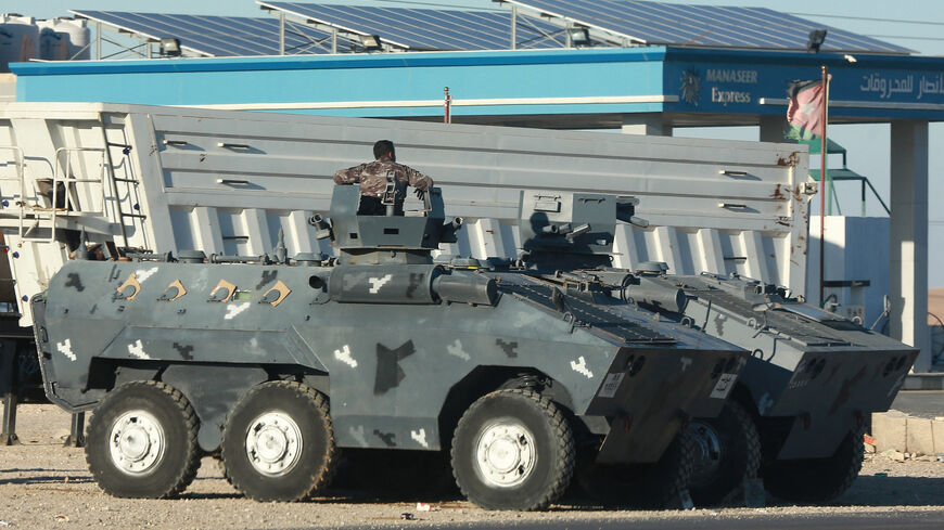 Jordanian security forces deploy their armoured vehicles in the southern city of Maan, some 220 kms south of the capital Amman, on December 16, 2022 hours after a senior police officer was shot dead in riots during a strike against rising fuel prices in the area. (Photo by KHALIL MAZRAAWI/AFP via Getty Images)