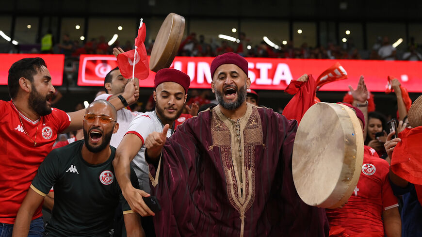 A Tunisia fan with a drum and wearing a traditional dress shows his support during the FIFA World Cup Group D match between Tunisia and France at Education City Stadium, Al Rayyan, Qatar, Nov. 30, 2022.