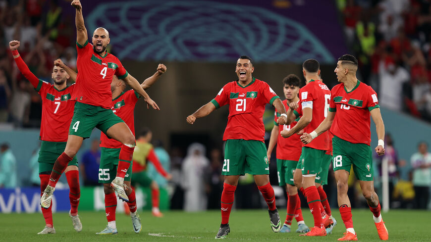Morocco players celebrate after their win in the penalty shoot out during the FIFA World Cup Qatar 2022 Round of 16 match between Morocco and Spain at Education City Stadium on December 06, 2022 in Al Rayyan, Qatar. (Photo by Julian Finney/Getty Images)