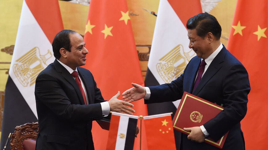 Egypt's President Abdel Fattah al-Sisi (L) greets Chinese President Xi Jinping (R) during a signing ceremony at the Great Hall of the People on December 23, 2014 in Beijing, China. President Abdel Fattah al-Sisi is undertaking his first visit to China in hopes to secure investment deals. (Photo by Greg Baker - Pool/Getty Images)