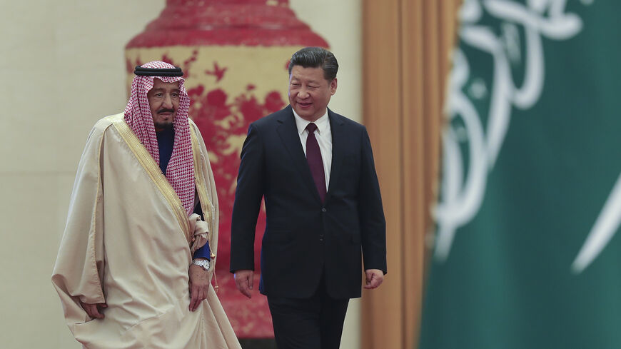 Chinese President Xi Jinping (R) invites Saudi Arabia's King Salman bin Abdulaziz Al Saud (L) to view an honor guard during a welcoming ceremony inside the Great Hall of the People, Beijing, China, March 16, 2017.