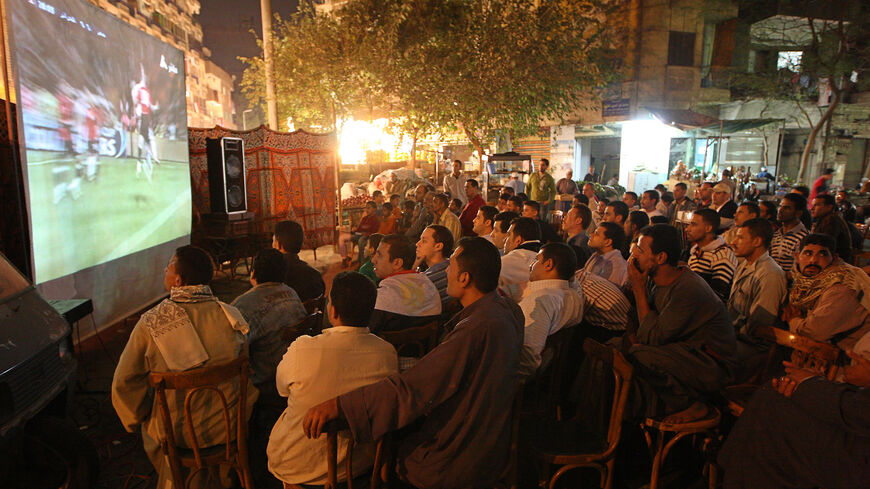 Egyptians watch the 2010 World Cup qualifying play-off soccer match between Egypt and Algeria, at a cafe in Cairo, Egypt, Nov. 18, 2009.
