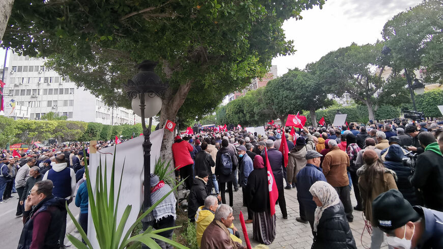 Supporters of Tunisian opposition groups march through the streets of downtown Tunis, Tunisia, Dec. 10, 2022.