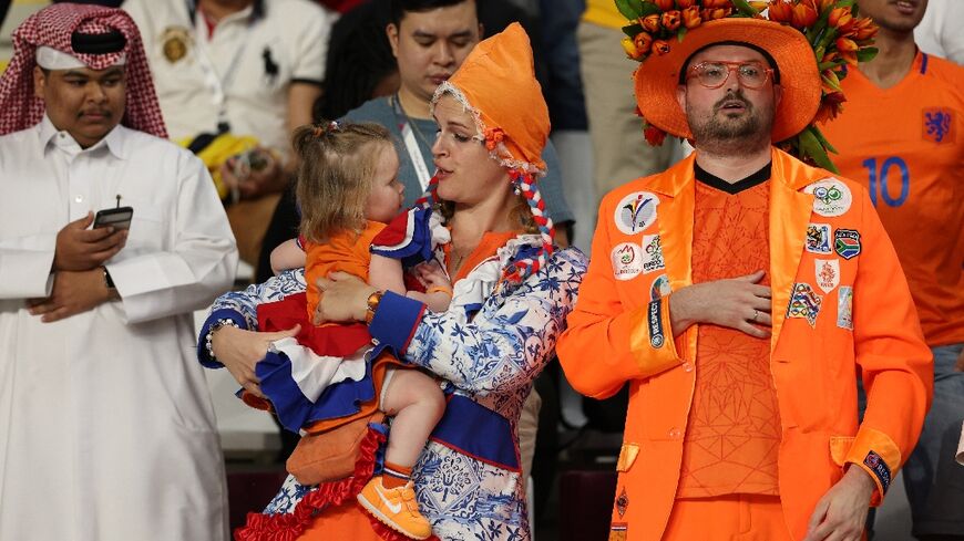 A family of Dutch supporters before their game versus in the US in Qatar