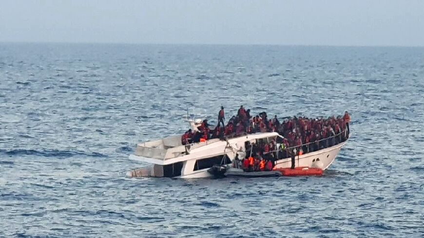 A photo provided by the Lebanese Army shows the distressed migrant boat in Mediterranean waters off the country's northern coast 