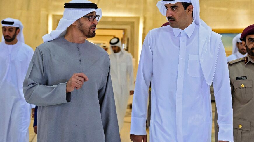 This handout picture provided by the UAE Ministry Of Presidential Affairs shows Qatar's Emir Sheikh Tamim bin Hamad Al-Thani (R) meeting with Emirati President Sheikh Mohamed bin Zayed al-Nahyan in Doha, on December 5, 2022