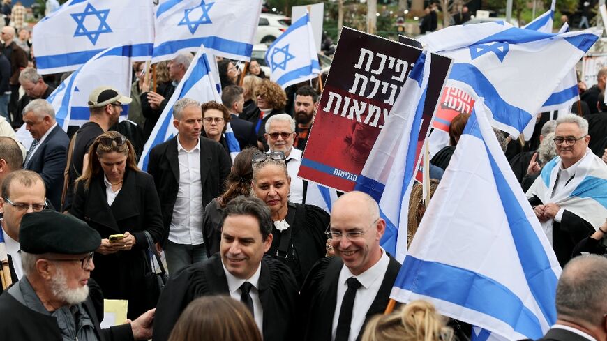 Lawyers protest the Israeli government's controversial plans to overhaul the judicial system, outside the Tel Aviv District Court of Justice on January 12
