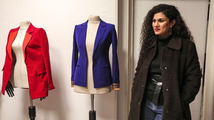 Alaa Adel, an Iraqi fashion designer, poses for a picture at her "Iraqcouture" studio in the capital Baghdad 
