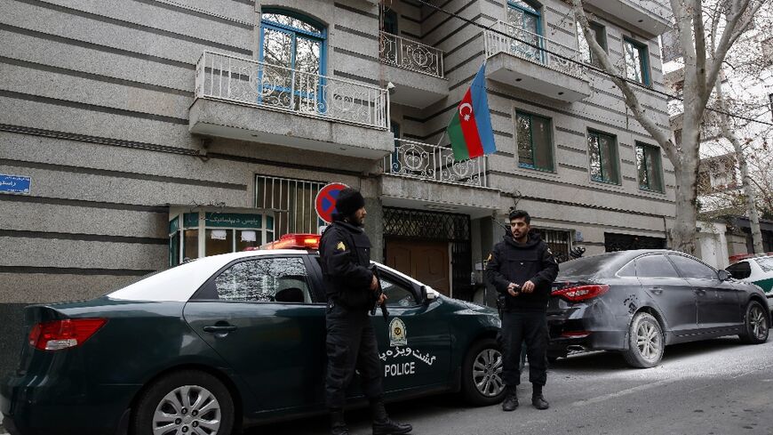 Police stand guard in front of the Azerbaijan embassy in Tehran  following Friday's attack