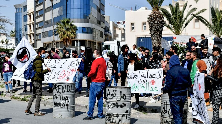Supporters of Tunisian non-government organisations demonstrate to demand the return to Italy of household waste exported illegaly to the country, in the Mediterranean port city of Sousse, on March 28, 2021
