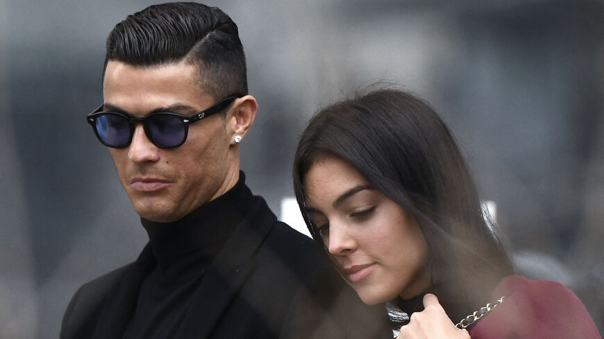 Former Real Madrid player Cristiano Ronaldo leaves with his Spanish girlfriend Georgina Rodriguez after attending a court hearing for tax evasion in Madrid on Jan. 22, 2019. 
