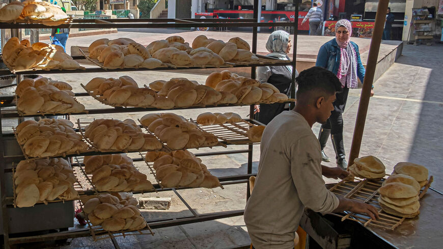 An Egyptian youth is seen working in a bakery at a market, Cairo, Egypt, March 17, 2022.