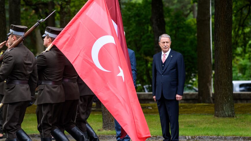Turkish Defence Minister Hulusi Akar attends a ceremony to honor fallen soldiers at the Brother's Cemetery in Riga city, on July 28, 2022 in Riga, Latvia. (Photo by GINTS IVUSKANS/AFP via Getty Images)