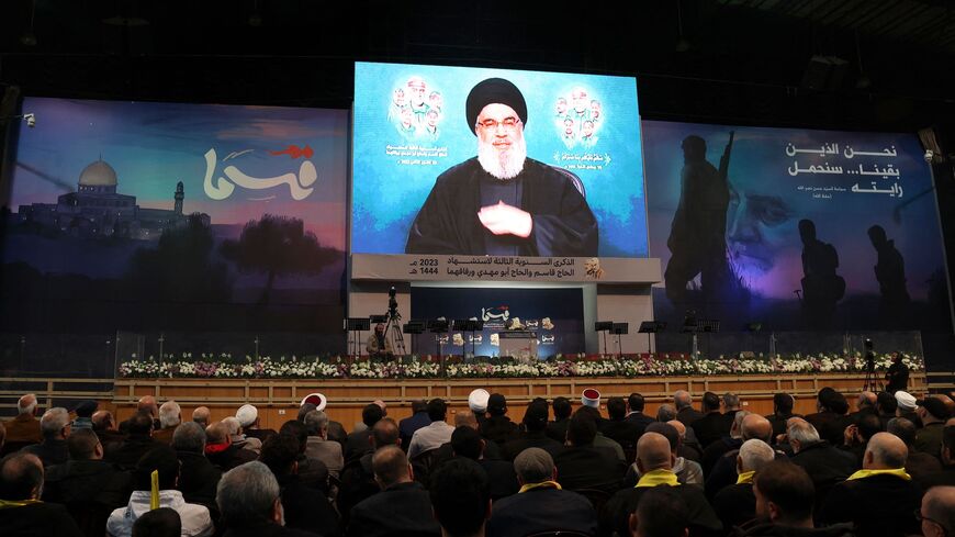 Supporters of the Lebanese Shiite movement Hezbollah attend a televised speech by the group's leader Hassan Nasrallah in the Lebanese capital Beirut's southern suburbs on Jan. 3, 2023 marking the third anniversary of the US killing of top Iranian Revolutionary Guards commander Qasem Soleimani and Iraqi commander Abu Mahdi al-Muhandis. 