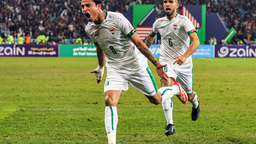 Iraq's midfielder Ibrahim Bayesh (L) reacts after scoring during the 25th Arabian Gulf Cup final football match between Iraq and Oman at the Basra International Stadium in Iraq's southern city on January 19, 2023. (Photo by AHMAD AL-RUBAYE/AFP via Getty Images)