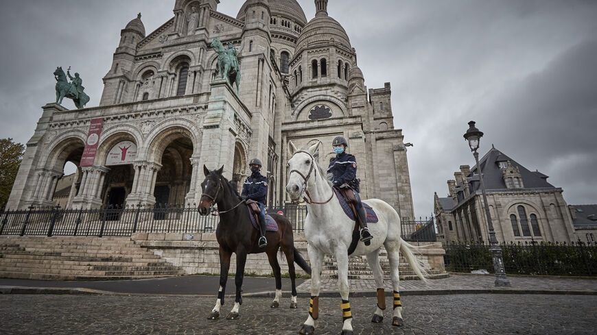 Mounted Police patrol in front of Sacré Cœur Basilica in Montmartre, Paris.