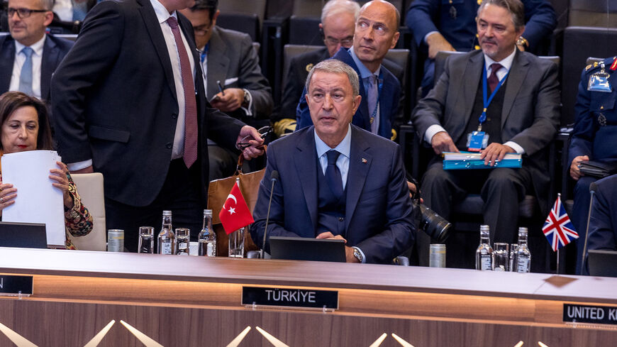 Turkish Defense Minister Hulusi Akar is seen seated at the start of the North Atlantic Council meeting on the final day of the NATO defense ministers' meeting at the NATO headquarters, Brussels, Belgium, Oct. 13, 2022.