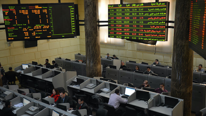 Stock market brokers work at the Egyptian Stock Market in the capital Cairo on January 6, 2013. A top International Monetary Fund official will visit Egypt on January 7, for talks likely to focus on the $4.8 billion loan agreement frozen last month because of political unrest in the country. AFP PHOTO / KHALED DESOUKI (Photo credit should read KHALED DESOUKI/AFP via Getty Images)
