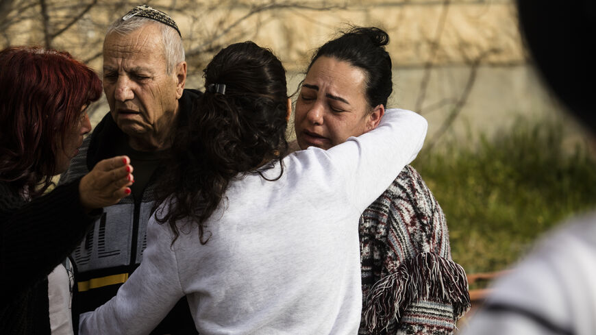 The family of Eli and Natali Mizrahi who died, react at the scene of a mass shooting which happened last night near a synagogue in the neighbourhood of Neve Yaakov on January 28, 2023 in Jerusalem, Israel. Eight people have been shot dead near a synagogue in North Jerusalem, with at least three others injured. (Photo by Amir Levy/Getty Images)