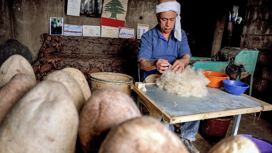 Hatmaker Youssef Akiki prepares to shape one of his traditional "labbadeh" caps with olive soap at his workshop in the mountain village of Hrajel 