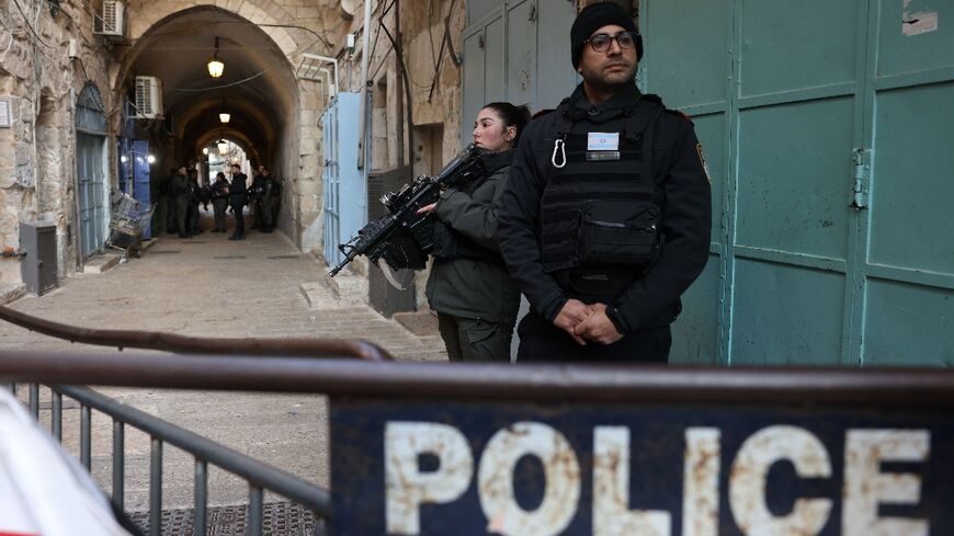 Israeli police stand guard in Jerusalem's Old City following a reported stabbing attack on February 13 