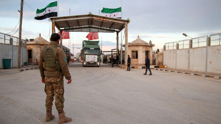 A convoy of trucks carrying humanitarian aid enters Syria through the Bab al-Salama crossing with Turkey