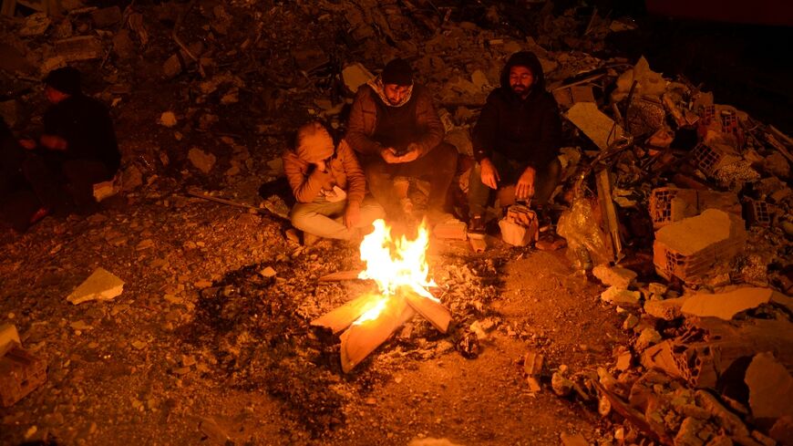 Turkish quake survivors who lost their homes are spending nights huddling around open fires