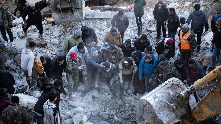 Searching rubble in Jableh, Syria, on Wednesday