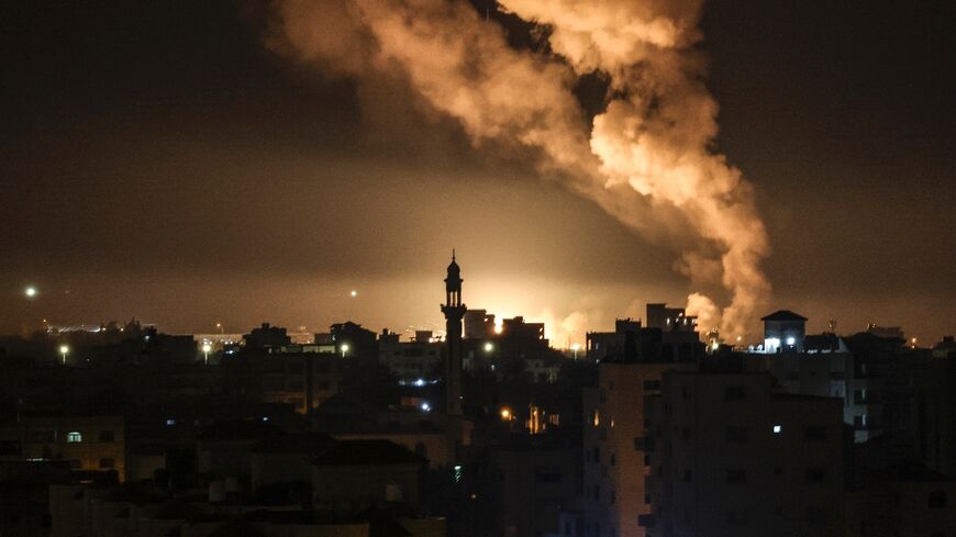 Fire and smoke rise above Gaza City after Israel launched air strikes on a Hamas facility in the Palestinian enclave early on February 13, 2023