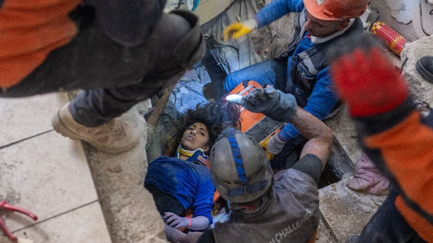 Crews rescue a 16-year-old girl from the rubble in southern Turkey