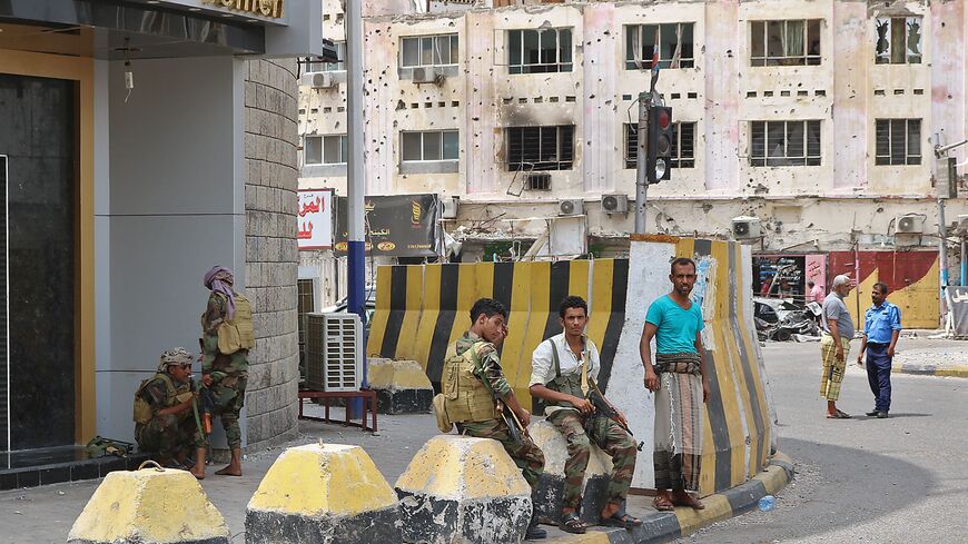 Backers of the the Southern Transitional Council (STC) which seeks independence for south Yemen, stand guard outside a bank in the Crater district in the centre of Yemen's second city of Aden on August 12, 2019. -  (Photo credit should read NABIL HASAN/AFP via Getty Images)