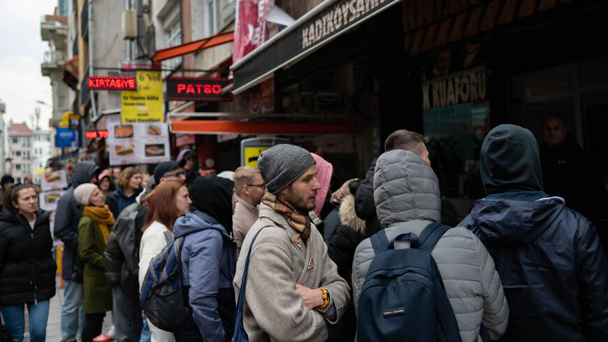 Russian physics researcher Yuriy waits in line for tickets to see Russian rapper Oxxxymiron on Kadikoy Street, Istanbul, Turkey, March 15, 2022.