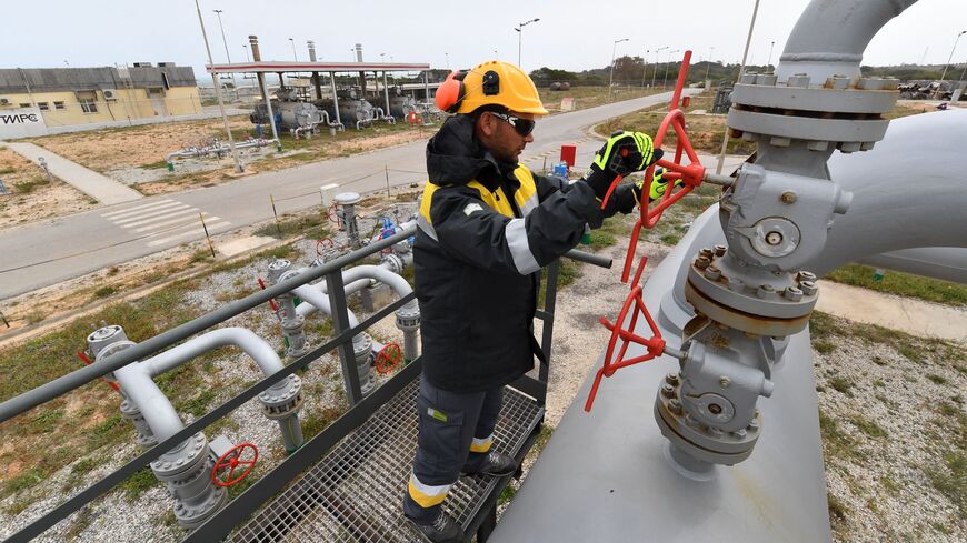 An employee works at the Tunisian Sergaz company, that controls the Tunisian segment of the Trans-Mediterranean (Transmed) pipeline, through which natural gas flows from Algeria to Italy, in El-Haouaria, some 100km east of the capital Tunis, on April 14, 2022. 