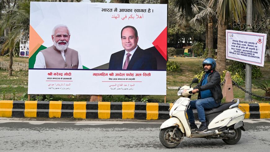 A motorist rides past a billboard welcoming Egypt's President Abdel Fattah El-Sisi, who will be chief guest at India's 74th Republic Day parade, in New Delhi on January 24, 2023. (Photo by Sajjad HUSSAIN / AFP) (Photo by SAJJAD HUSSAIN/AFP via Getty Images)