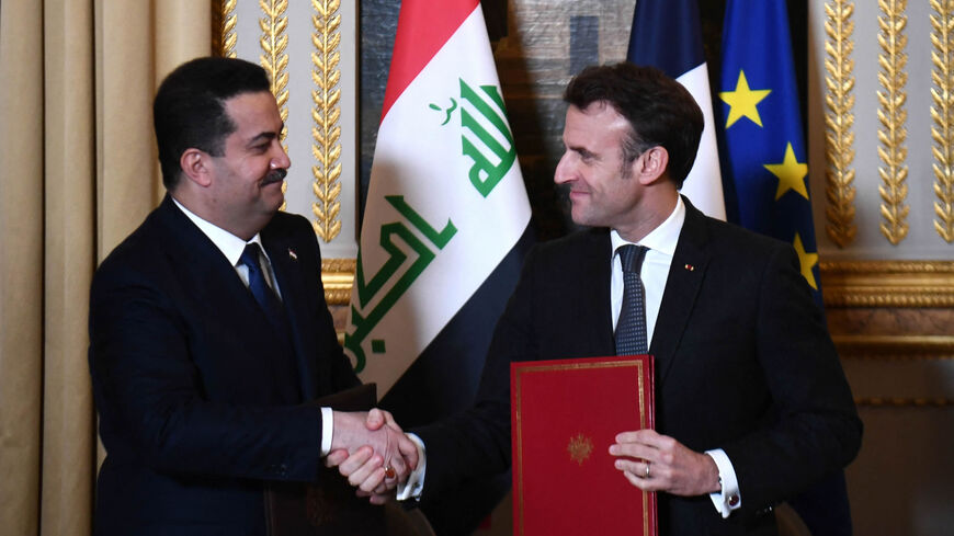 French President Emmanuel Macron welcomes Iraq's Prime Minister Mohammed Shia al-Sudani at the Elysee Presidential Palace, Paris, France, Jan. 26, 2023.