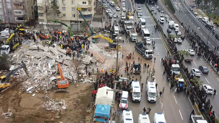Rescuers search for survivors through the rubble in Sanliurfa, on Feb. 6, 2023, after a 7.8-magnitude earthquake struck the country's south-east. -