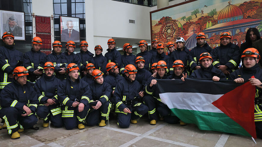 A Palestinian relief team poses for a picture before their departure to Syria and Turkey.