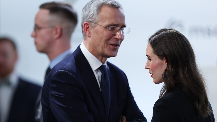 Jens Stoltenberg, Secretary General of NATO, speaks with Sanna Marin, Prime Minister of Finland, during the 2023 Munich Security Conference (MSC) on February 18, 2023 in Munich, Germany. The Munich Security Conference brings together defence leaders and stakeholders from around the world and is taking place February 17-19. Russia's ongoing war in Ukraine is dominating the agenda. (Photo by Johannes Simon/Getty Images)