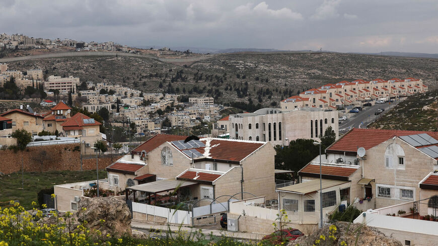 A picture taken from the east Jerusalem Palestinian Shuafat refugee camp shows a view of the settlement of Pisgat Zeev (C), in the northern part of Israeli-annexed east Jerusalem, and the Palestinian area of al-Ram in the occupied West Bank (background), Feb. 23, 2023.