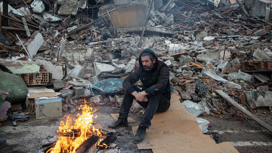 A man waits for news of his loved ones, believed to be trapped under collapsed building on February 08, 2023 in Hatay, Turkey. A 7.8-magnitude earthquake hit near Gaziantep, Turkey, in the early hours of Monday, followed by another 7.5-magnitude tremor just after midday. The quakes caused widespread destruction in southern Turkey and northern Syria and were felt in nearby countries. (Photo by Burak Kara/Getty Images)