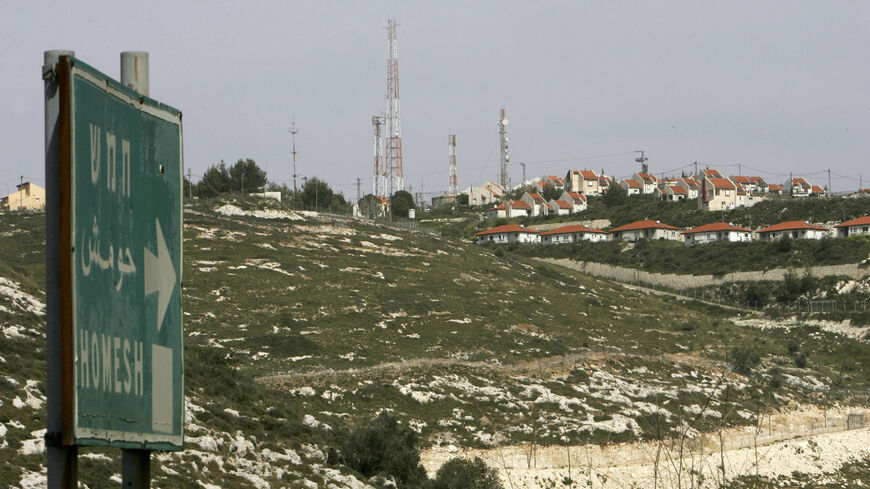 A road sign points the way to the West Bank settlement of Homesh, northern Samaria, West Bank, April 19, 2005.