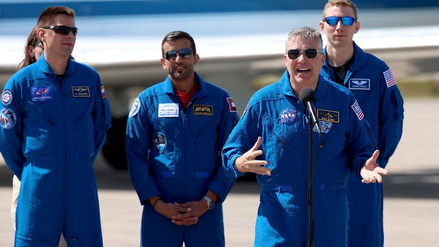 From L-R, Russian cosmonaut Andrey Fedyaev, astronaut Sultan Al-Neyadi of the United Arab Emirates, mission commander Stephen Bowen of NASA and pilot Warren Hoburg of NASA speak to reporters in Cape Canaveral, Florida