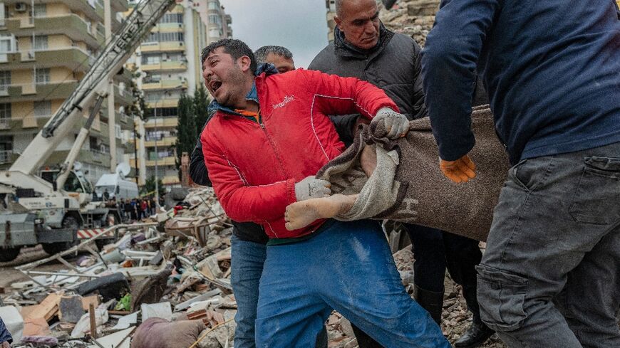 Rescuers pulled victims and survivors from buildings collapsed by an earthquake in Turkey