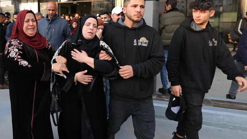The mother and relatives of a young Palestinian boy react, after he was reportedly shot dead by Israeli forces during confrontations in the West Bank town of Jenin, on February 12