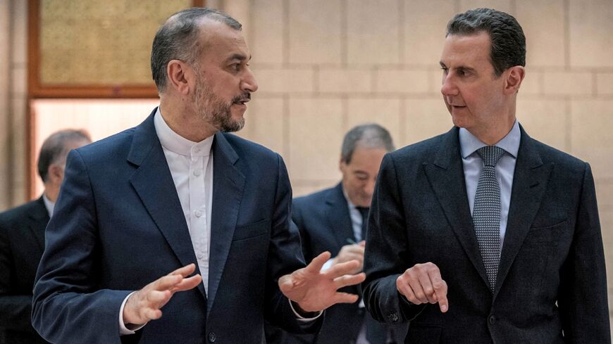 Syria's President Bashar al-Assad (R) met with Iran's Foreign Minister Hossein Amir-Abdollahian in Damascus